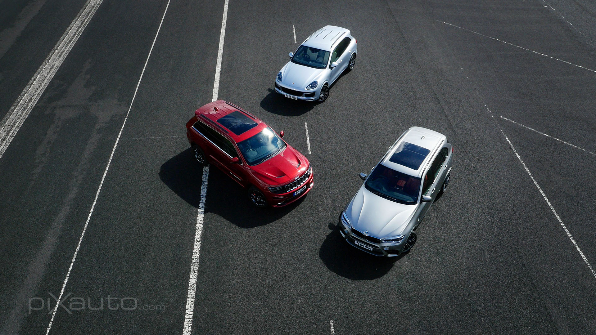 Aerial froup photo of SUVs on airfield