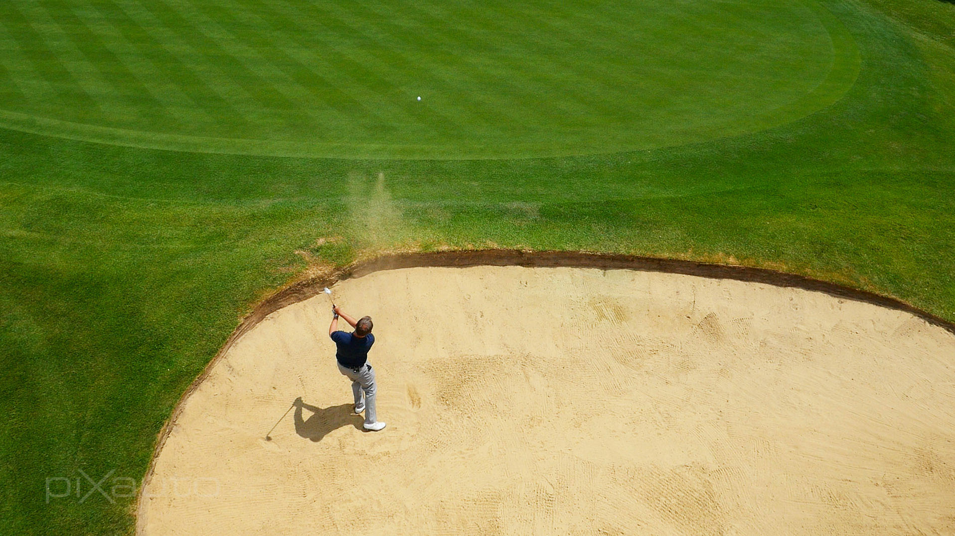 Aerial photo of professional golfer in a bunker